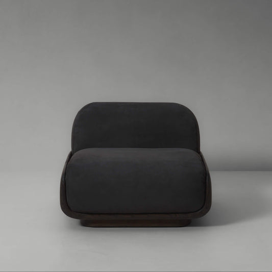 Dark gray armchair on a plain background